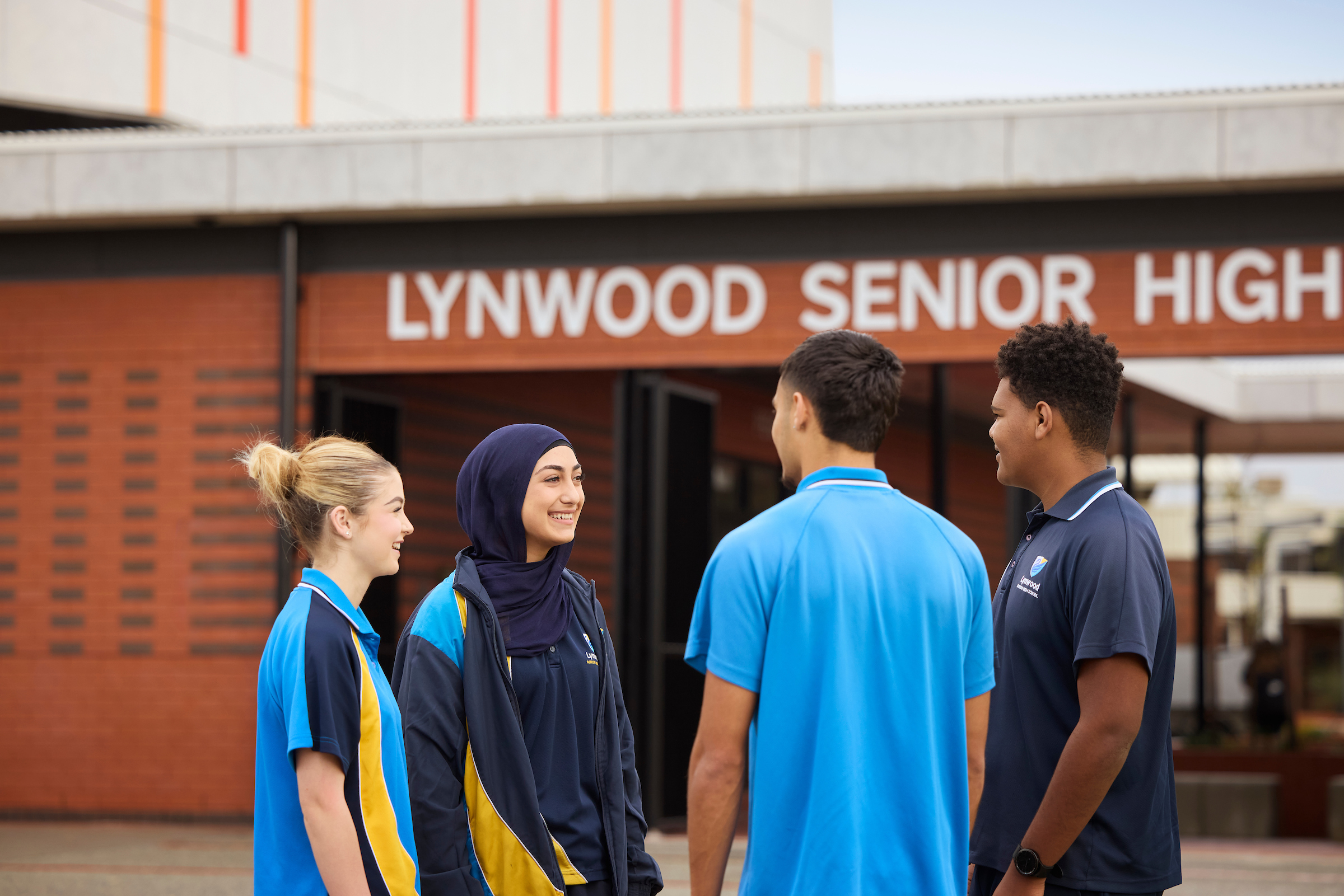 Students chatting front of school